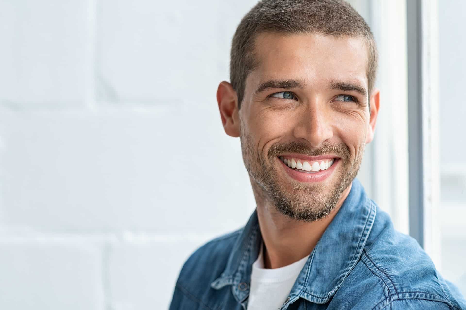 Happy smiling man looking away | Gladiator Health MD Riverdale UT