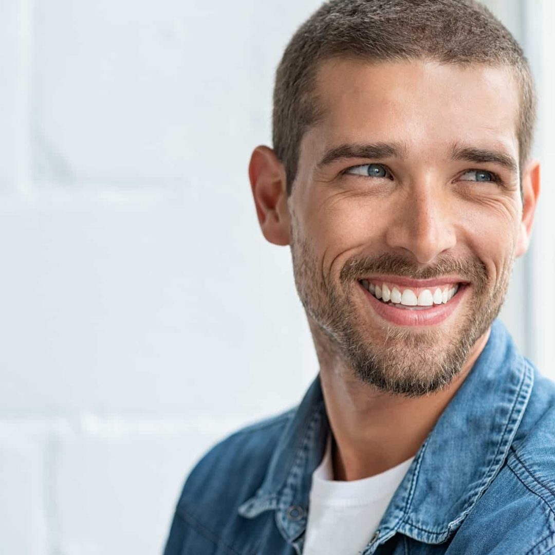 Happy smiling man looking away | Gladiator Health MD Riverdale UT